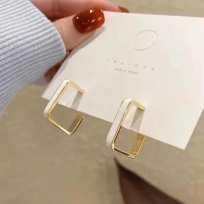 “Ivory Edge Korean Studs” – Chic Simplicity in Every Angle