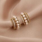 “Golden Halo Korean Earrings” – Grace in a Glimmering Curve